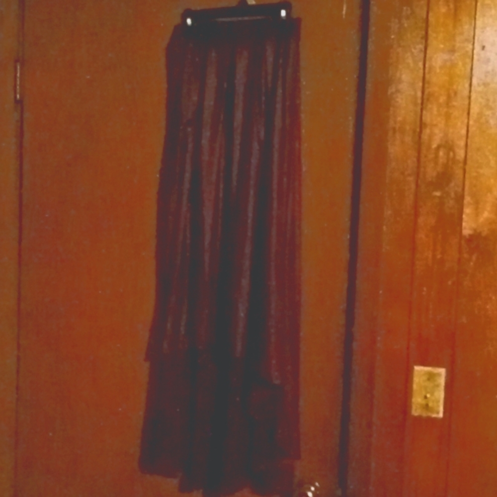 A burgundy high low leather skirt